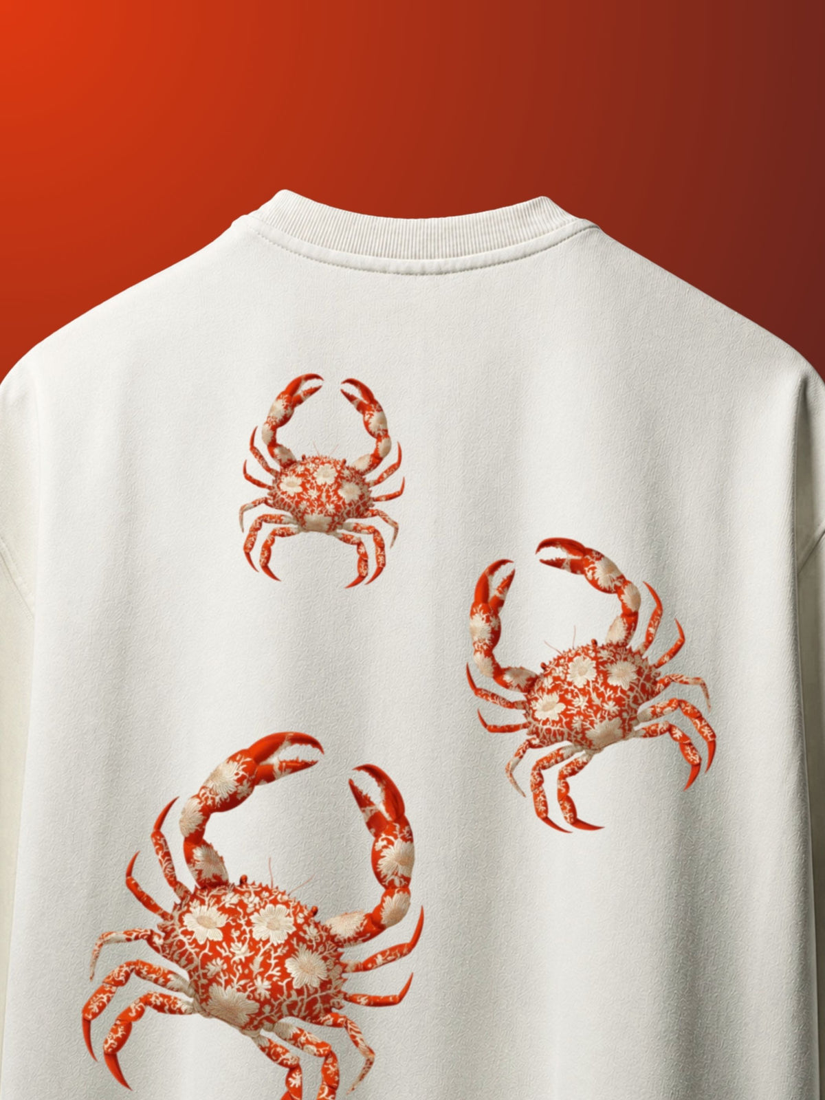 White tshirt with red crab designs on a red background