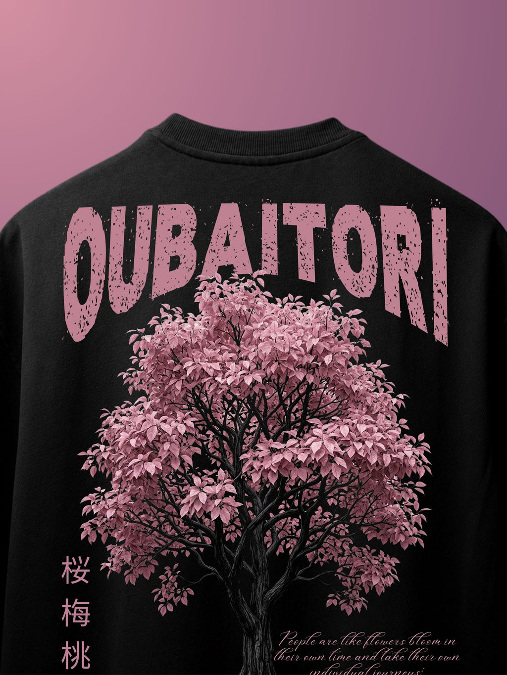 A black  tshirt shown from the back, featuring a large pink cherry blossom tree graphic and the word 'OUBAITORI' in distressed pink letters across the upper back.