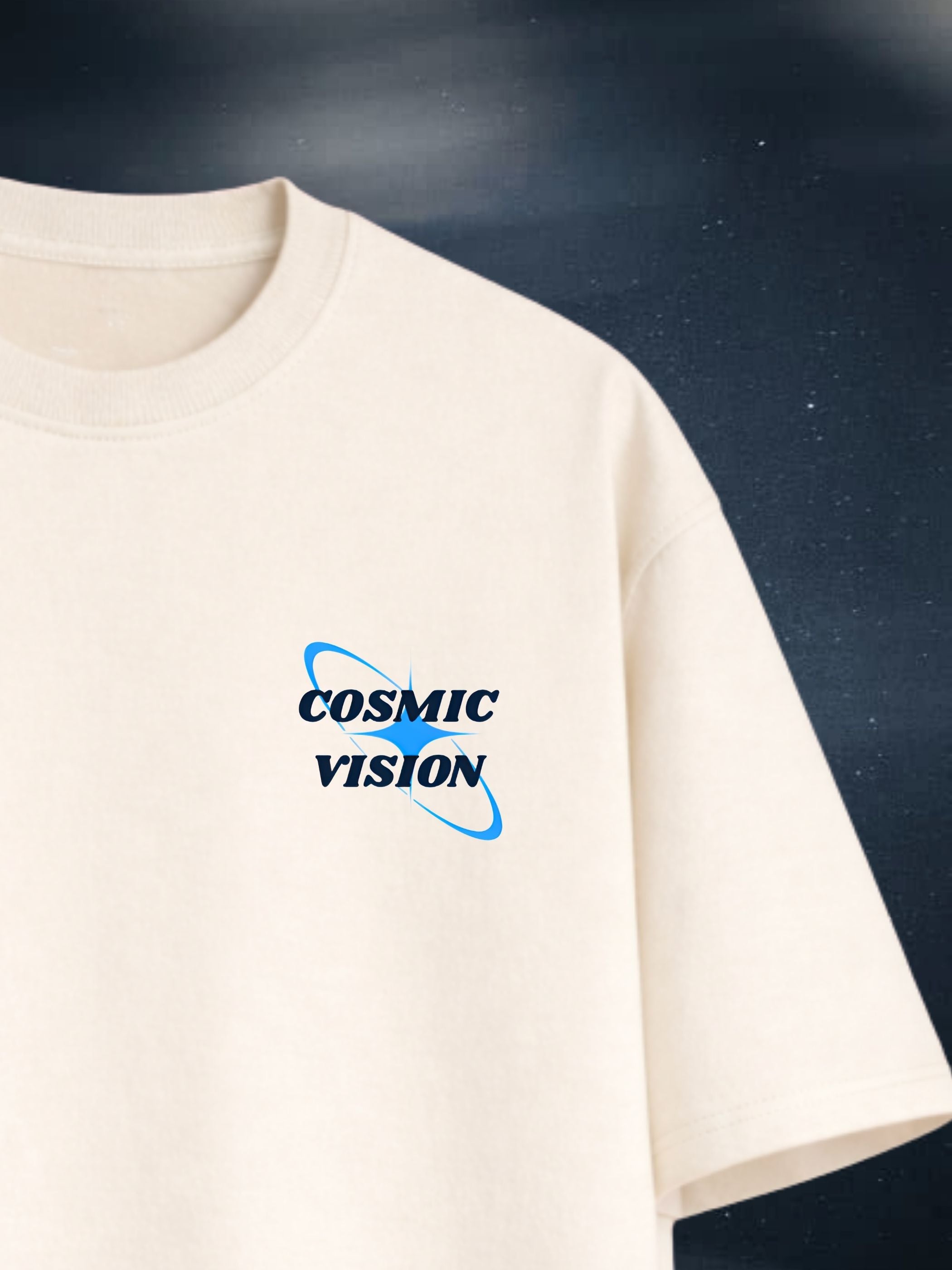 The Cosmic Vision cream boxy fit T-shirt with small navy graphic on chest