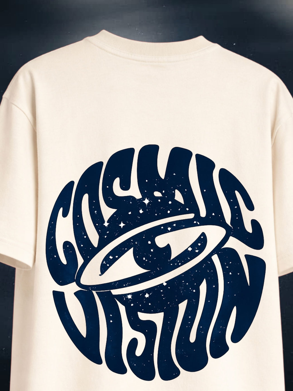 The Cosmic Vision cream boxy fit T-shirt with navy cosmic graphic on back