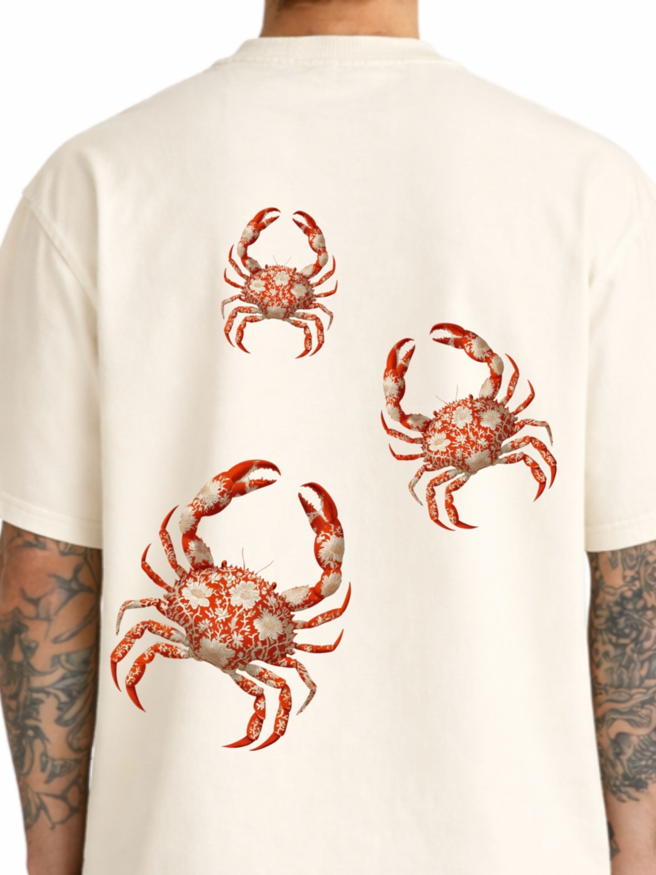 Close-up of The Crab Mentality off white boxy fit T-shirt back with red crab graphics