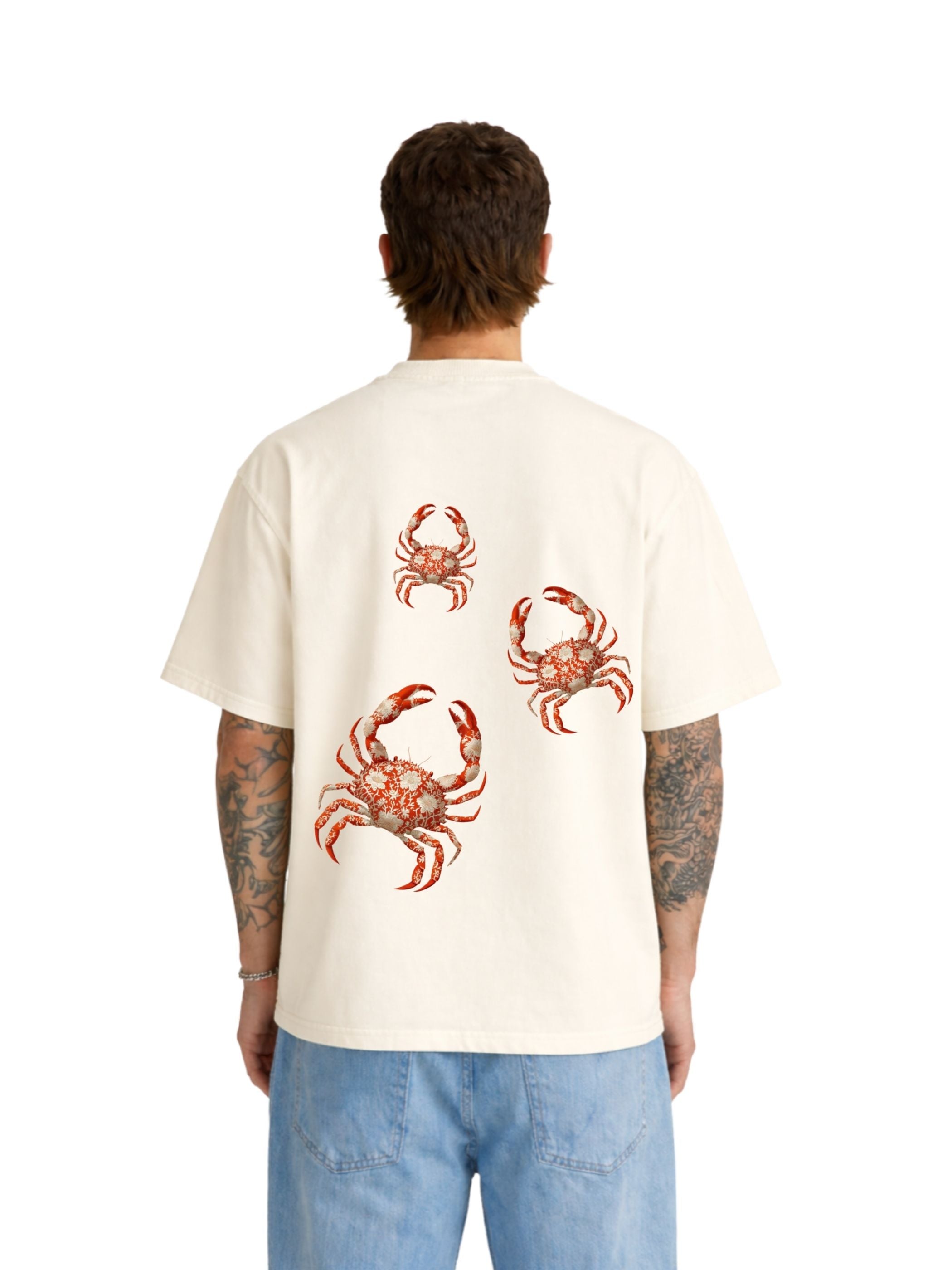 Model wearing The Crab Mentality off white  boxy fit T-shirt with red crab graphics on back