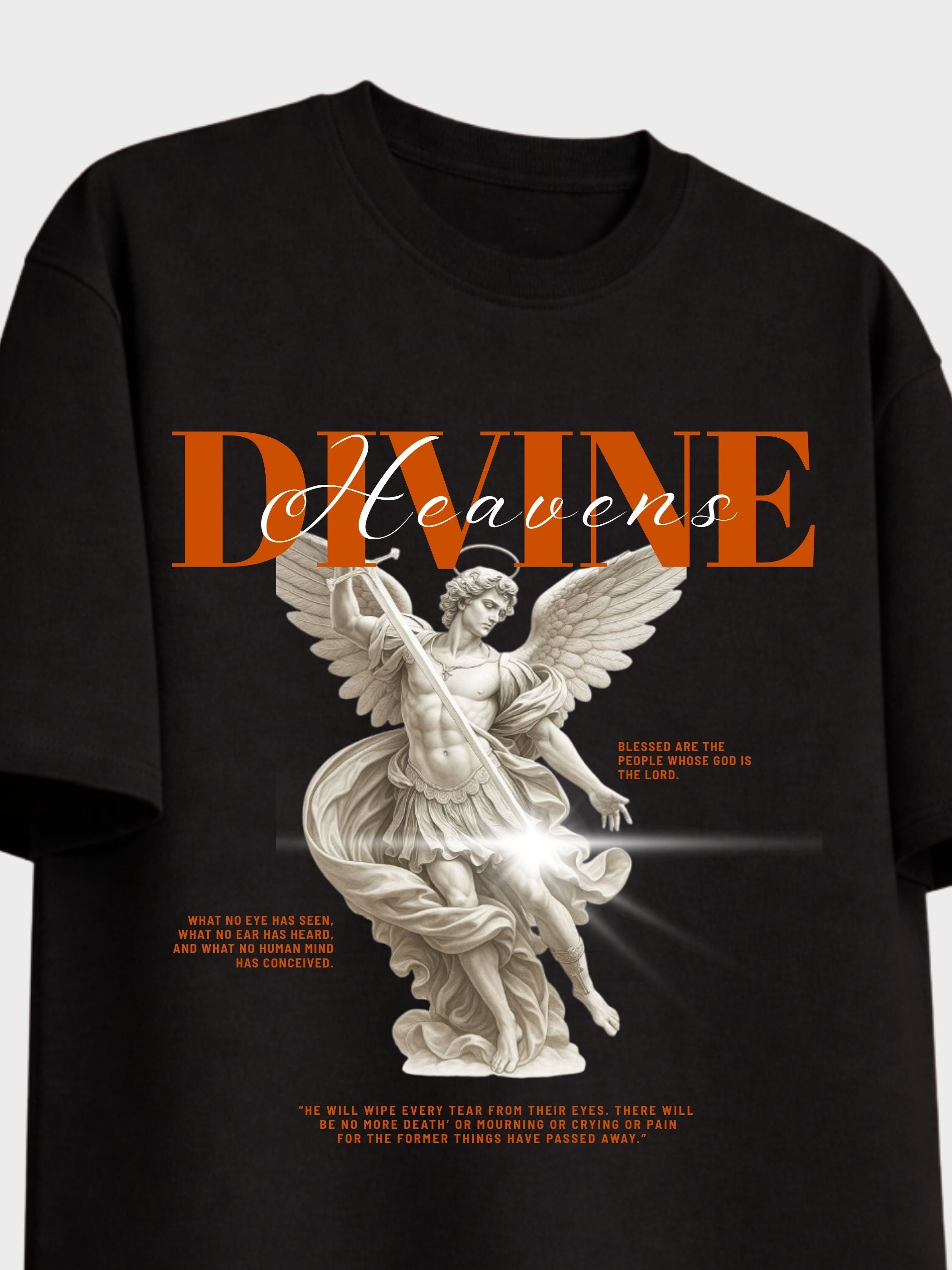 A black short-sleeve graphic T-shirt featuring a large front print with the word 'Divine' in orange and white script over an angel statue illustration, shown on a light gray background.