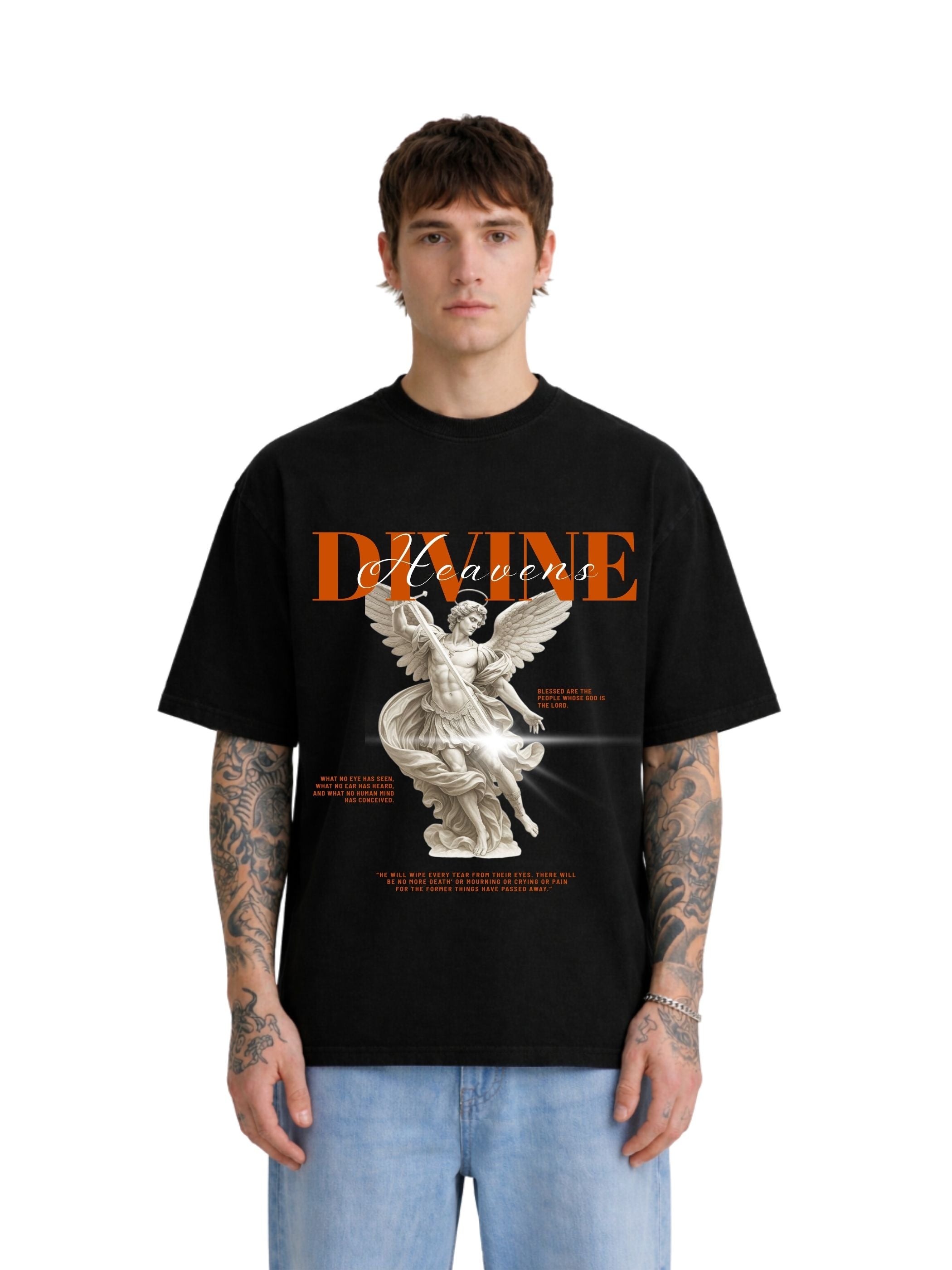 Model wearing Divine Heaven black boxy fit T-shirt with angel graphic on front