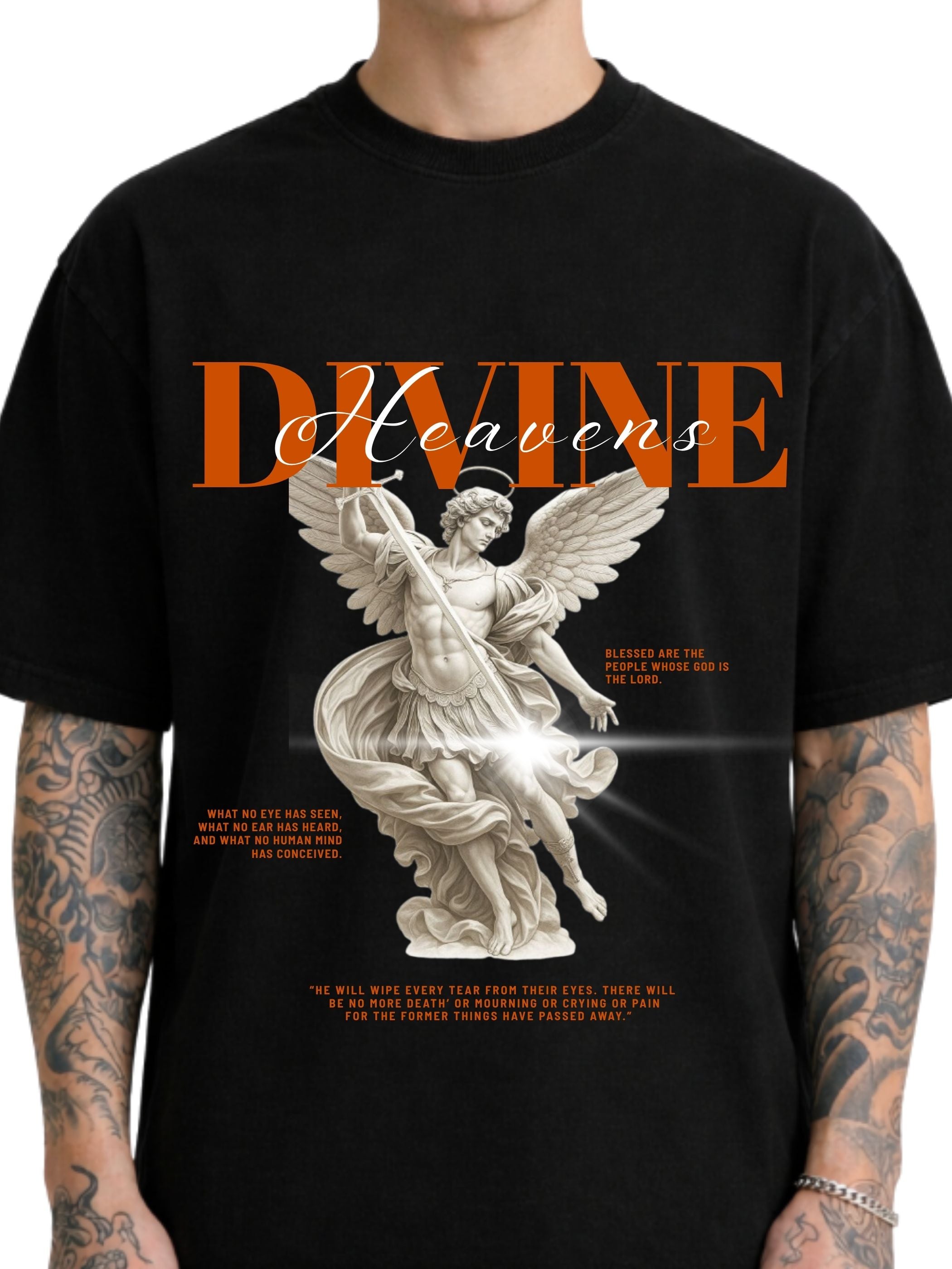 Close-up of Divine Heaven black boxy fit T-shirt with angel illustration and orange typography