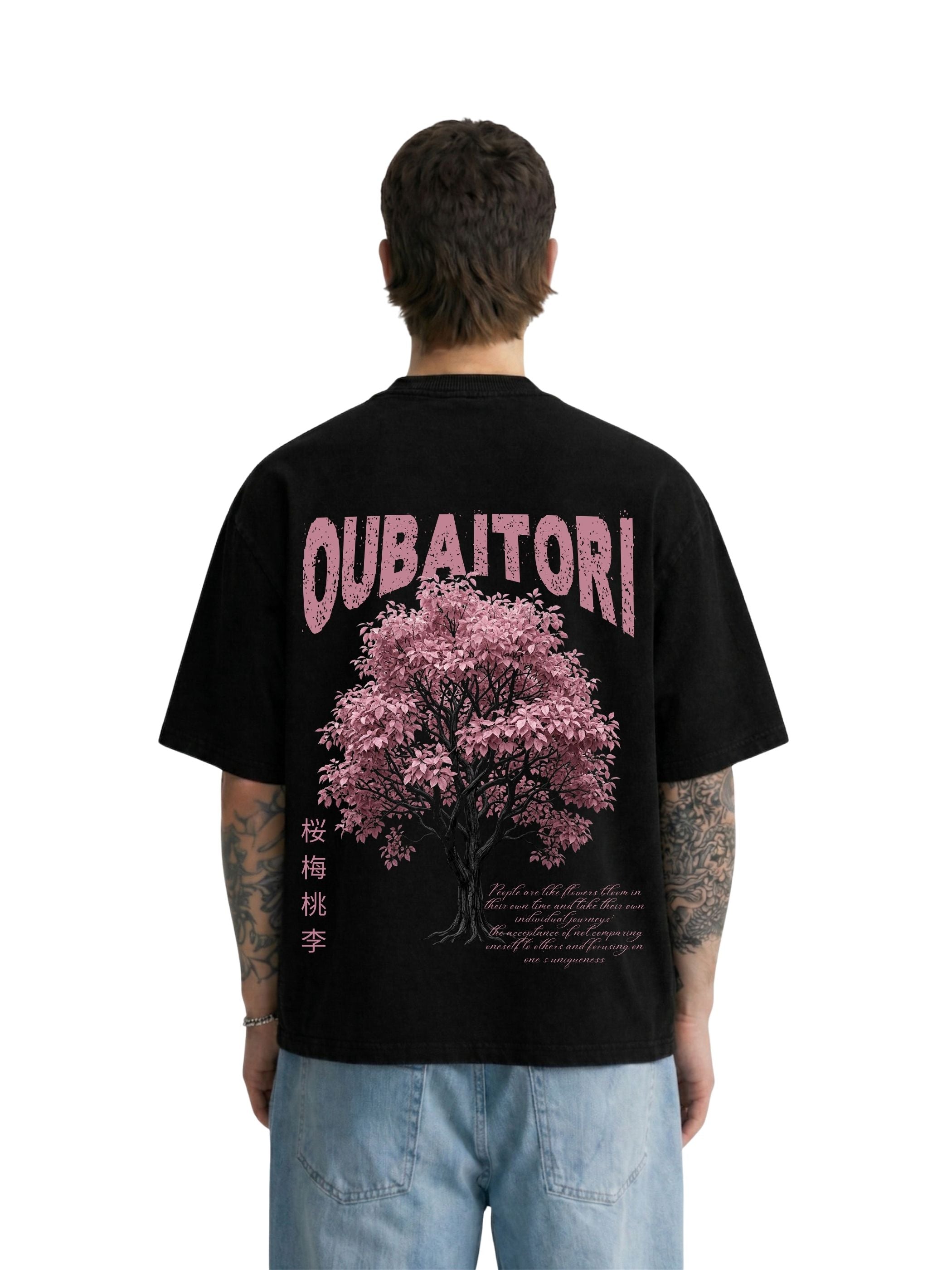 Model wearing Oubaitori Blk black boxy fit T-shirt with pink tree graphic on back