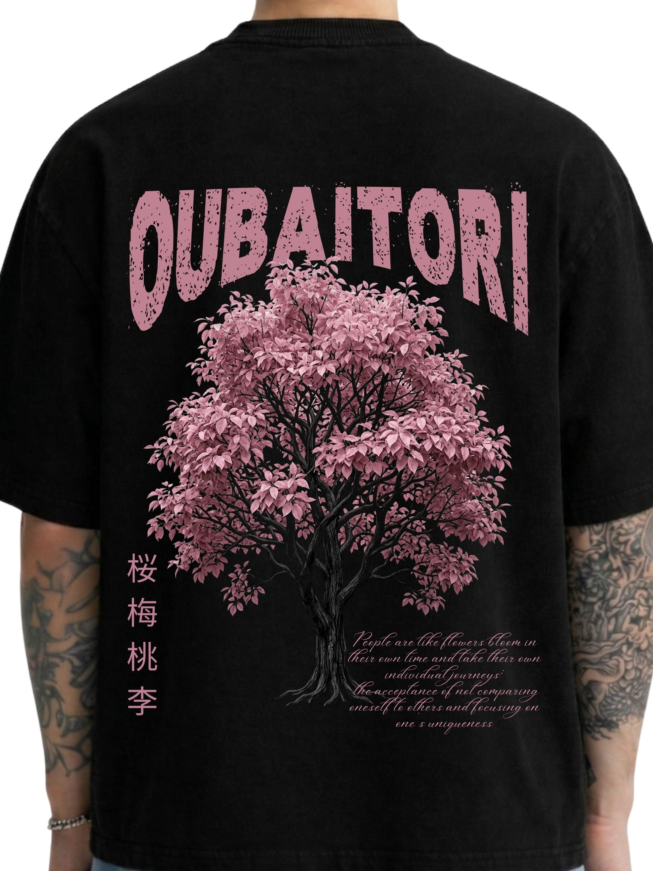 Close-up of Oubaitori Blk black boxy fit T-shirt back with pink tree graphic and typography