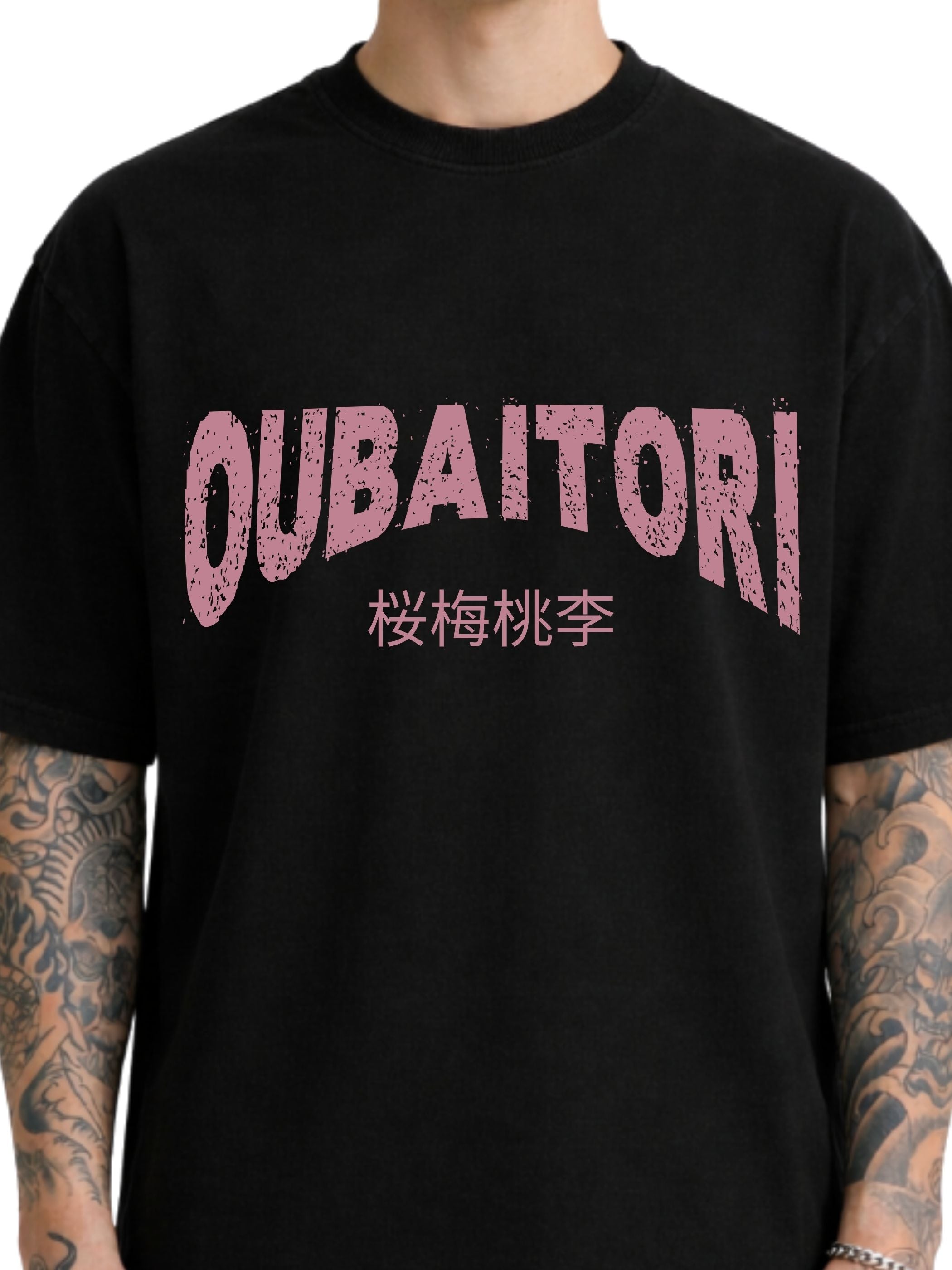 A black short-sleeve t-shirt with a distressed pink graphic on the chest reading 'OUBAITORI' and Japanese characters underneath, shown on a model.